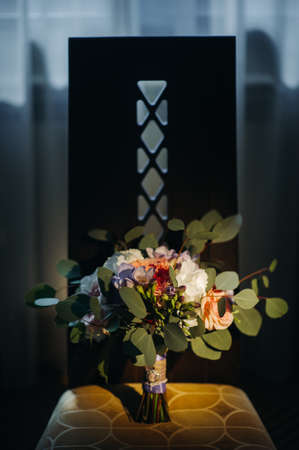 wedding bouquet with roses and boutonniere.の写真素材