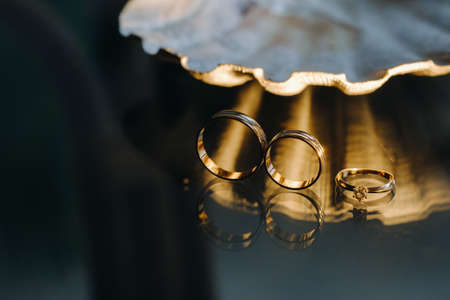 A pair of gold wedding rings.Two wedding rings.