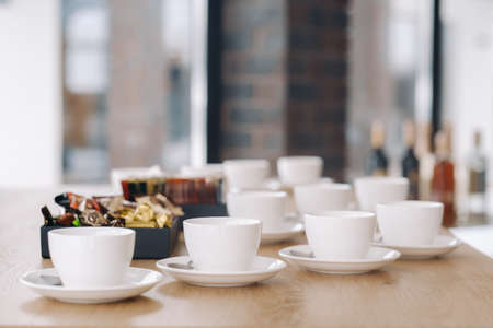 White tea cups with saucer standing on the table ..