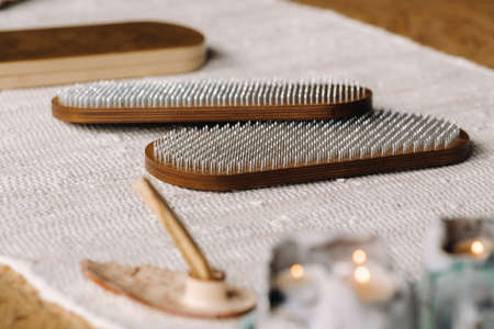 A smoking Palo Santo stick and boards with nails for yoga classes.の写真素材