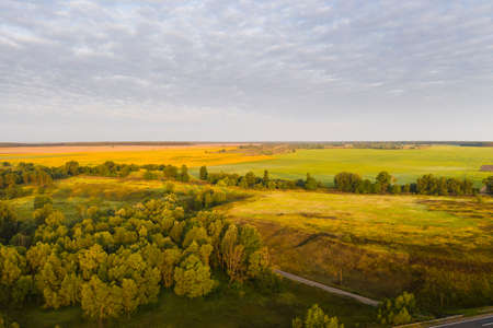 amazing sunrise in the countryside over forests and fields in Ukraine.