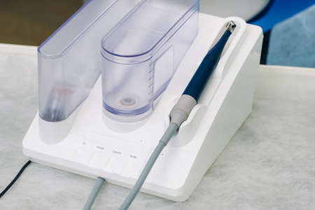 Ultrasonic scaler in the dental office. Dentistry concept.