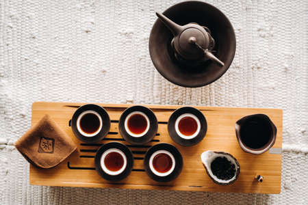 Preparing for a tea ceremony with a large company.の写真素材