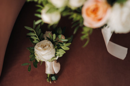Boutagniere for the groom made of fresh pink flowers. wedding details.