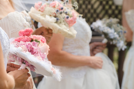 Many brides hold their wedding bouquet in their hands.の写真素材