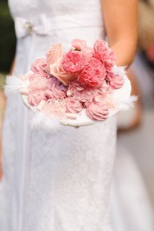 The bride holds her wedding bouquet in her hands.の写真素材