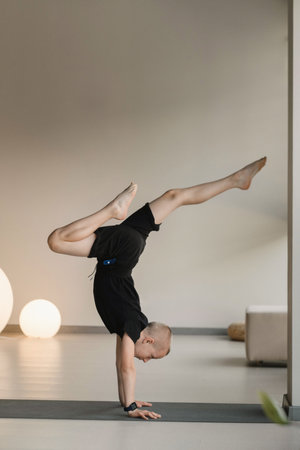 A child practices yoga poses indoors. Children's yoga.