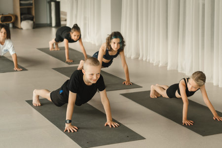 Children do Yoga in the fitness room. Children's gymnastics.の写真素材