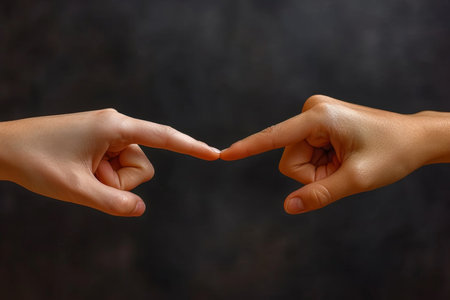 Two hands with fingers tip to tip. contact or communication between people.の素材