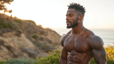 A muscular man stands proudly on a cliff overlooking the sea at sunset. The warm glow highlights his physique, embodying strength and serenity amid the stunning coastal landscape.の素材