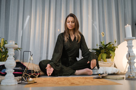 Meditation practice in a serene indoor setting with calming elements and soft lighting during an...