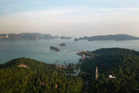 A serene view of the distant islands of Kilim Park on LAngkawi Island at sunset. Malaysiaの写真素材