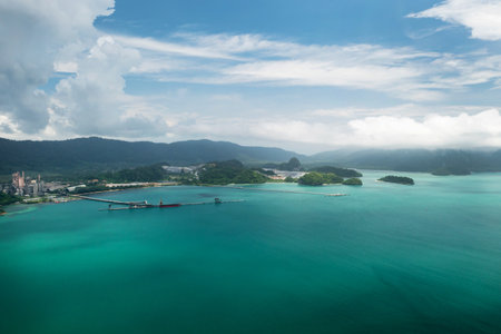 Beautiful tropical green islands on Langkawi Island, surrounded by clear blue waters.