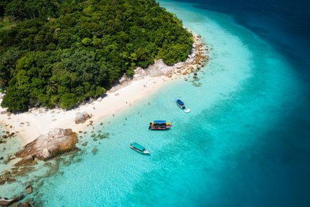 Secluded beach with white sand and large rocks on Lang Tengah Island, Terengganu, Malaysiaの写真素材