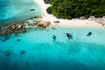 Aerial view of a tropical beach with white sand and coral reef on the island of Lang Tengah, Terengganu, Malaysiaの写真素材