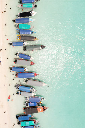Aerial view of Turtle Beach and tourist boats on Redang Island in Malaysia. Tropical beach in...