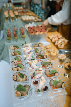 Elegant buffet display featuring a variety of gourmet appetizers at a gathering in a stylish venue