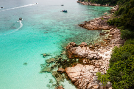View of the tropical beach on Redang Island. Turtle beach and tourists on boats on Redang Island.の写真素材