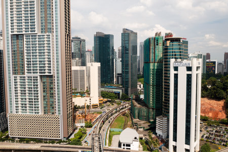 KUALA LUMPUR, MALAYSIA - August 11, 2025. Aerial view of Kuala Lumpur city center with high-rise buildings, roads and new construction sitesのeditorial素材
