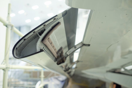 an aircraft wing flap mechanism showing the maintenance conditions of an aircraft with tools and...