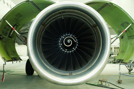 A large aircraft engine that highlights the complex details of its design and engineering during...