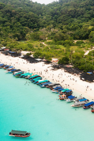Aerial view of Turtle Beach on Redang Island in Malaysia. A cluster of tourist boats on a tropical beach.の写真素材