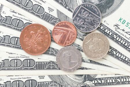 100 dollar bills and coins of Britain