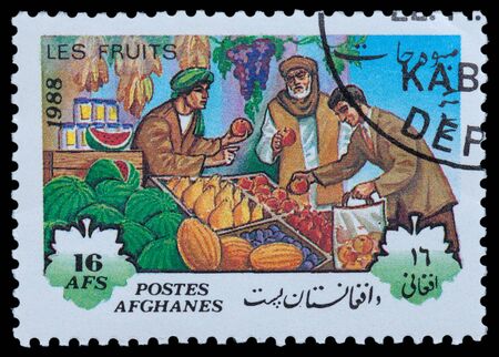 AFGHANISTAN - CIRCA 1988: A stamp printed in Afghanistan, shows Oriental Bazaar, a series of fruits, circa 1988のeditorial素材