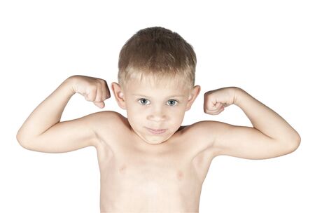 little boy is showing his arm muscles, isolated on the white backgroundの写真素材