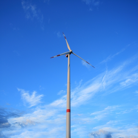 Windmill against a blue sky - renewable energy conceptの写真素材