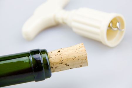 Bottle Openers and wine placed on the grey background の写真素材