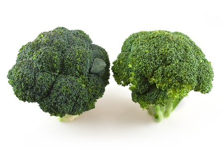 Two fresh broccoli in white backgroundの写真素材