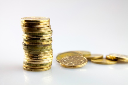  Coins stacking up on the white backgroundの写真素材