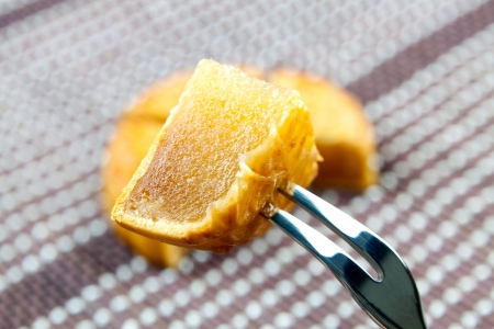 Knife and fork on the moon cakeの写真素材