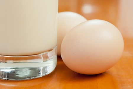 Together two eggs and a cup of soy milkの写真素材