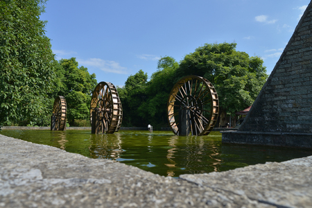 Waterwheel in the pondの写真素材