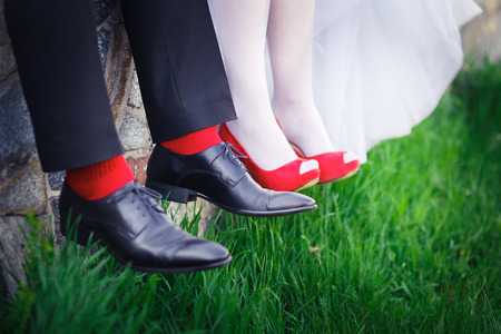 Wedding shoes red women on the green grass in styleの写真素材