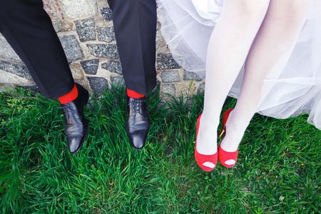 Wedding shoes red women on the green grass in styleの写真素材