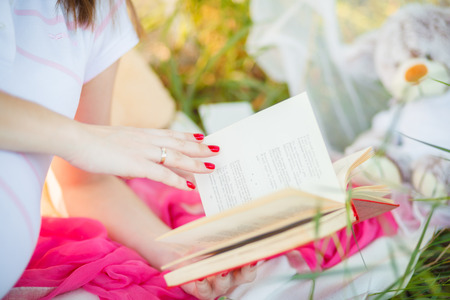 Young beautiful couple in anticipation of the baby pregnancy poppy fieldの写真素材