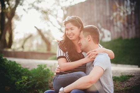 loving couple in the park spring eveningの写真素材