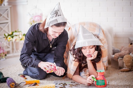 Young couple making repairs at homeの写真素材