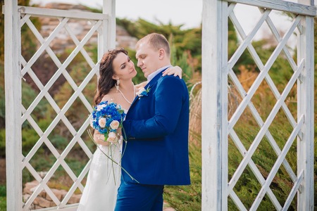 Happy bride and groom on their wedding summerの写真素材