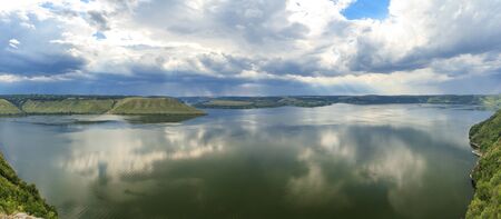 view of the river from a high bankの写真素材