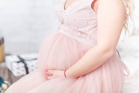 pregnant woman new year indoorの写真素材