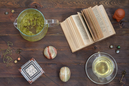 Still-life with green tea and a bookの写真素材