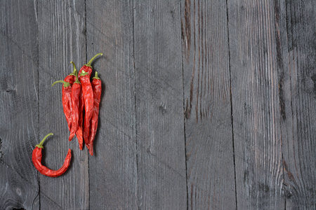Peppers on wooden backgroundの写真素材
