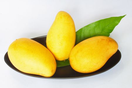 Yellow mango isolated on white backgroundの写真素材