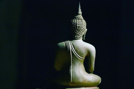 Light of Buddha image in the dark background.の写真素材