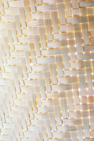 Handmade wooden entwined seats piled up on top of each other. の写真素材