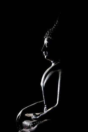 Light of Buddha image in the dark background.の写真素材